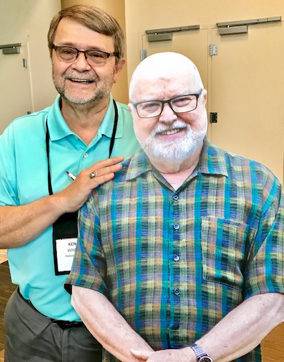 The Rev. Ken Whitt, Baptist pastor and author, poses with a full-size cut out of Catholic author Richard Rohr at an Albuquerque conference.