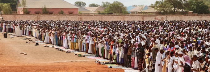 Muslims pray outdoors in Somalia on Eid al-Fitr. Photo by Abdi Dagane, courtesy Wikimedia.