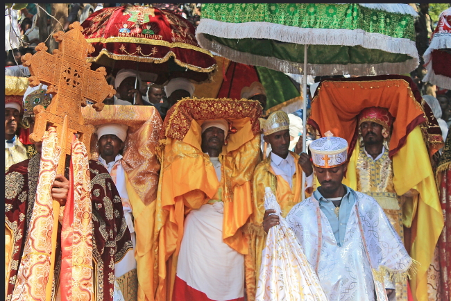 priests with colorful umbrellas, Timkat